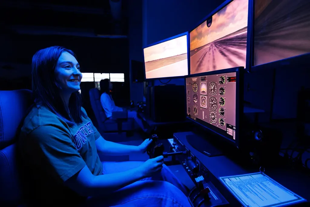 Young woman using a flight simulator