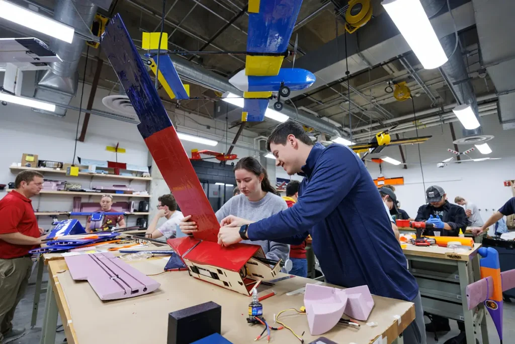 Young man and woman working on an aero design